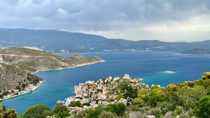 View from above of the town on Kastellorizo (Megisti) Island, Greece. Greek island travel, Mediterranean vacation, scenic landscape, summer tourism, traditional architecture, coastal town. 