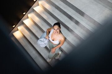 Top view of smiling professional athlete going to the gym.