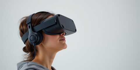Fototapeta premium Young woman wearing virtual reality headset and headphones exploring immersive experience