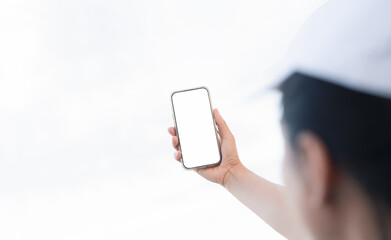 Person holding smartphone with blank screen on white background,Image ideal for mobile app mockup, UI,UX design presentation, digital lifestyle content, and technology marketing visuals