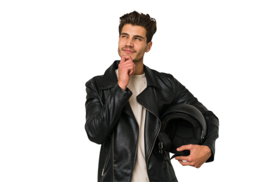 Young caucasian man holding a motrbike black helmet isolated looking sideways with doubtful and skeptical expression.