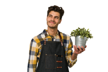 Young caucasian gardener man isolated on white background dreaming of achieving goals and purposes