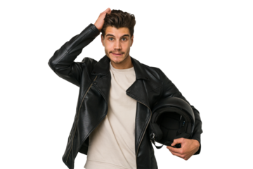 Young caucasian man holding a motrbike black helmet isolated being shocked, she has remembered important meeting.