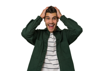 Young handsome caucasian man isolated on white background screaming, very excited, passionate, satisfied with something.