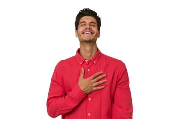Young handsome caucasian man isolated on white background laughs out loudly keeping hand on chest.