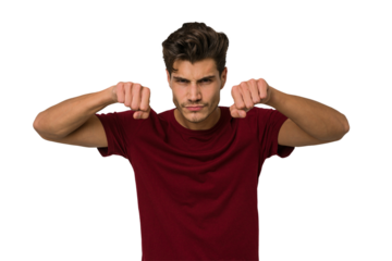 Young handsome caucasian man isolated on white background throwing a punch, anger, fighting due to an argument, boxing.