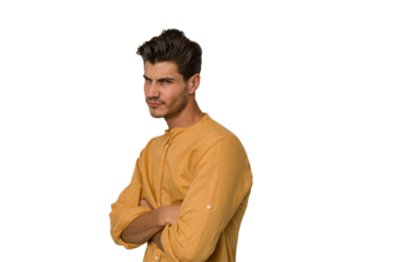 Young handsome caucasian man isolated on white background suspicious, uncertain, examining you.