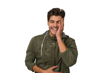 Young handsome caucasian man isolated on white background laughs happily and has fun keeping hands on stomach.