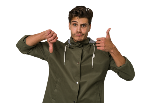 Young handsome caucasian man isolated on white background showing thumbs up and thumbs down, difficult choose concept