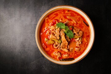 Panaeng pork curry in white plate