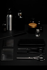 Minimalist Flatlay of Barber Tools and Grooming Products on Black Surface.