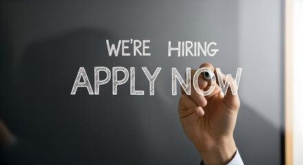 We're Hiring: Hand Writes Apply Now on Glass Wall for Job Opportunities