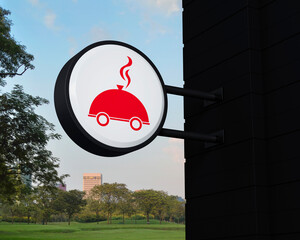 Restaurant cloche flat icon on hanging black rounded signboard over green grass field and trees in park, Business food delivery online concept, 3D rendering