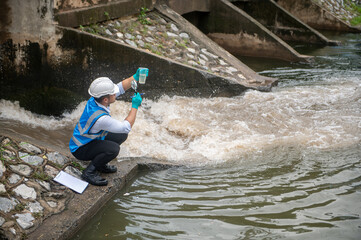 water resource officer is checking for contaminant in public water sources to preserve the ecosystem
