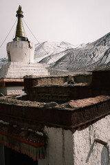Rongbuk Monastery, the highest monastery in the world, near Mount Everest in Tibet. Ancient Buddhist site with prayer flags and snowy Himalayan peaks in the background