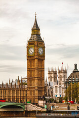 Vertical view of Elizabeth Tower and Palace of Westminster with Westminster Bridge over River Thames in London