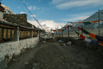 Rongbuk Monastery, the highest monastery in the world, near Mount Everest in Tibet. Ancient Buddhist site with prayer flags and snowy Himalayan peaks in the background