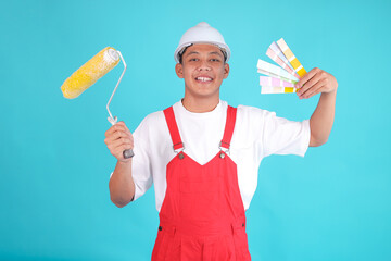 Smiling Painter Man in Red Overalls Holds Paint Roller and Color Swatches, Ready for Project