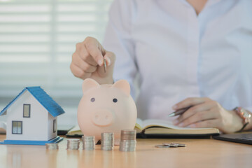 Real estate agents discuss real estate investment and mortgage plans, and provide financial advice...