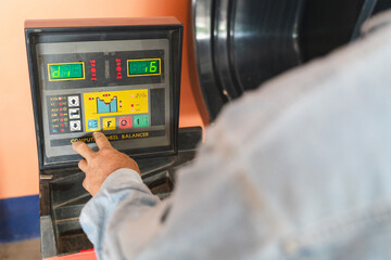 Modern Computerized Wheel Balancer Display Used in Auto Shops to Ensure Proper Wheel Alignment and Enhance Vehicle Performance and Safety