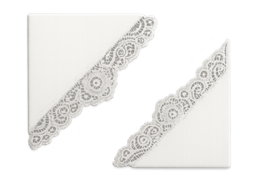 Two white napkins with delicate lace edges laid diagonally