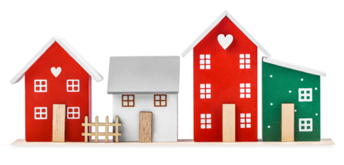 Colorful wooden decorative houses with hearts and windows isolated, festive Christmas village decoration