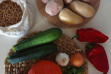 Collection of healthy fruits, vegetables and legumes on white background. Top view.