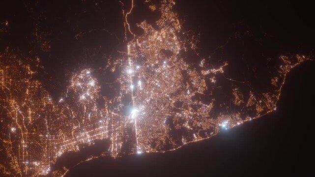 Tijuana (Mexico) top view at night. Aerial view on modern city with lights. Camera is flying above the city, moving backward. Vertical video. The north is on the left side