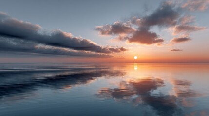 Fototapeta premium A serene sunset over calm waters, reflecting vibrant hues and soft clouds, creating a tranquil and picturesque coastal scene.