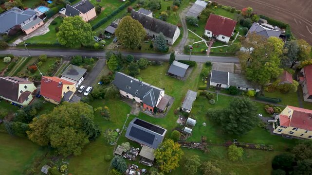 Aerial Freiberg Germany homes city valley slide. City center rural travel in eastern Germany. Historical buildings and landmarks. Urban historic center of East Germany. Total destruction in WW II.