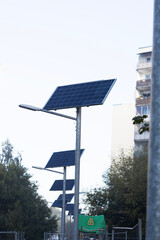 Solar panels stand tall in an urban park, providing renewable energy and promoting sustainability in community areas