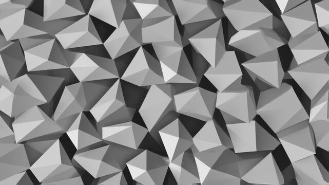 Abstract geometric pattern of many overlapping triangular shapes in shades of gray