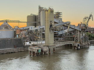 Old grain terminal at seaport with loading conveyor and silos 1 © Iryna