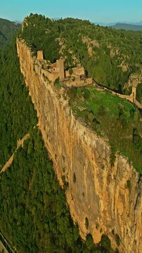  Mornas Fortress stands majestically on top of a rocky cliff. The Fortress of Mornas is a medieval fortress above the village of the same name in the French department of Vaucluse
