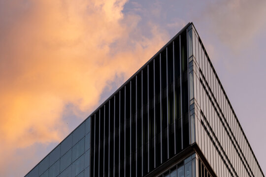 Minimalist architecture with sharp geometric lines and golden light offering copy space for editorial or corporate design applications