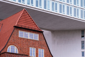 Geometric contrast between modern architecture and traditional roof design creating visual balance and copy space for contemporary branding composition