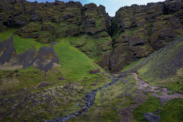 The dramatic Raudfeldsgja Gorge cuts deep into the cliffside.