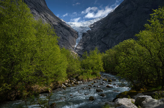 A river winds beneath Briksdalsbreen Glacier.