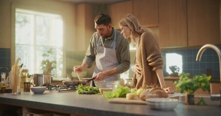 Romantic Cooking Scene at Home. A Caring Husband Stirs Pasta on the Stove, Then Gently Feeds His Wife a Taste of the Meal, Both Laughing and Enjoying Their Time Together in the Kitchen - Powered by Adobe