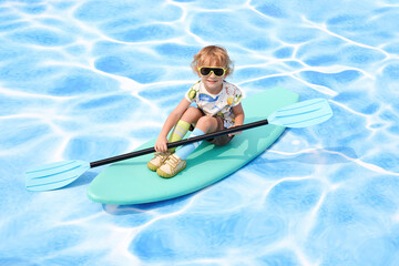Child kayaking on a colorful float in a sunny pool setting.