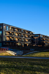 Obraz premium Сontemporary Residential Building with Glass and Wood Accents