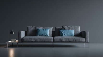 Modern gray sofa with blue pillows and side table against a dark wall