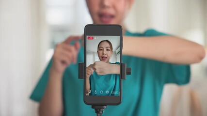 Young adult woman asia people anti aging expert modern nurse live talk video call selfie camera mobile phone app mental health care Online digital virtual asian vlogger filming hand wrist pain physio. - Powered by Adobe