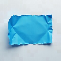 a piece of blue torn paper on white background