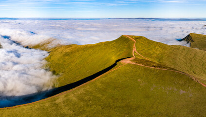 Hiking trail along the summit of Corn Du emerging from a blanket of fog and clouds