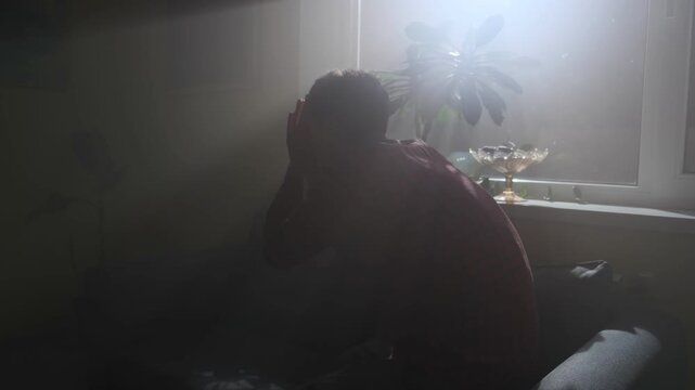 Man praying and asking God for help at night