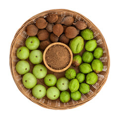 Indian Gooseberry ,terminalia chebula and terminalia bellirica fruits and powder on transparent background.triphala thainame.top view.