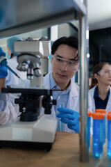 Lab work, Doctor holds a test tube takes the test from a test tube in analysis, blood, DNA, test...