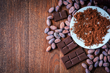 Cocoa powder ,organic cocoa beans Ingredient for preparing chocolate . Top view of Chocolate bar