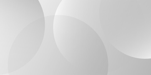 A minimalist abstract background featuring overlapping curves and circular shapes in various shades of gray, creating a smooth gradient and subtle depth